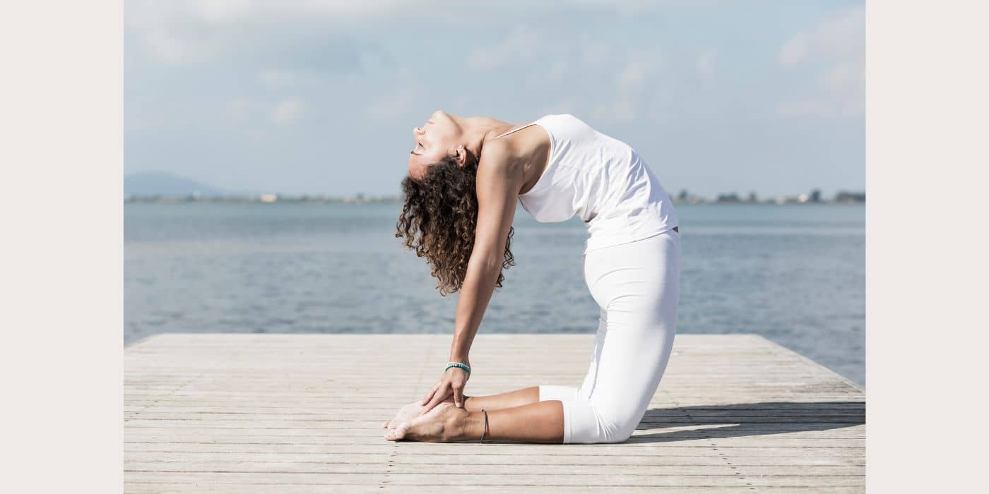 Woman in a camel yoga pose.